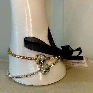 Two gold and silver bracelets with large stone